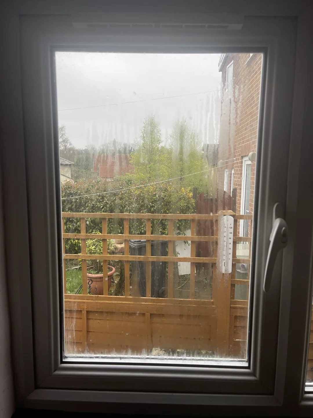 Misted double glazed unit in a uPVC window before Restoration Glazing replaced it